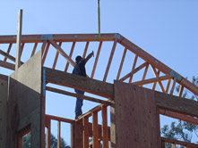 precise placement of roofing materials with a large crane